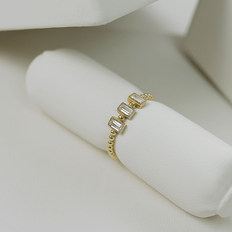 Closer view of the same baguette band showing the step-cut stones.