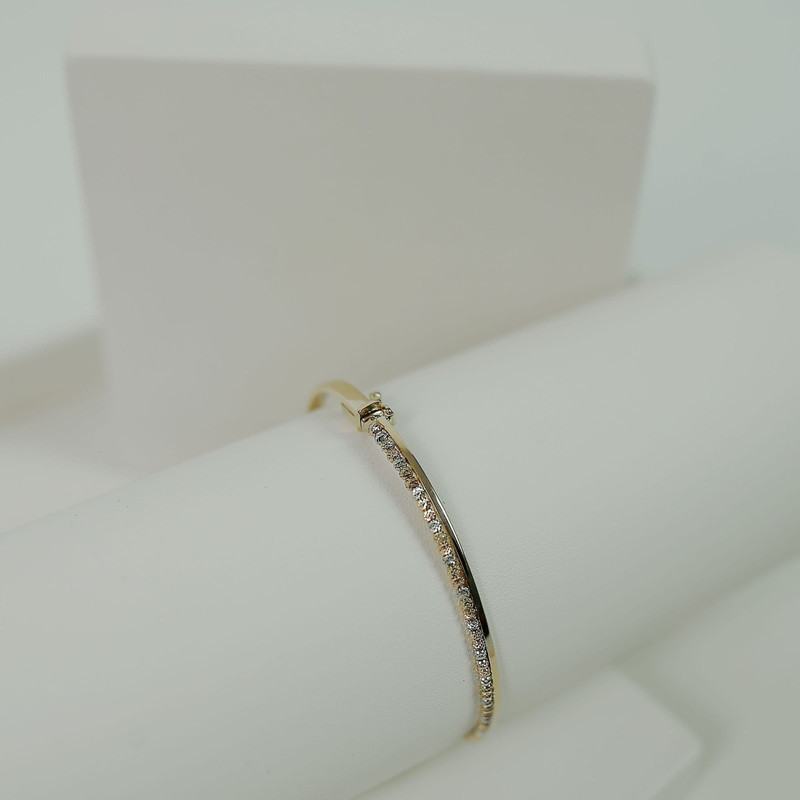 Second angle of the same pavé bangle on a white roll.
