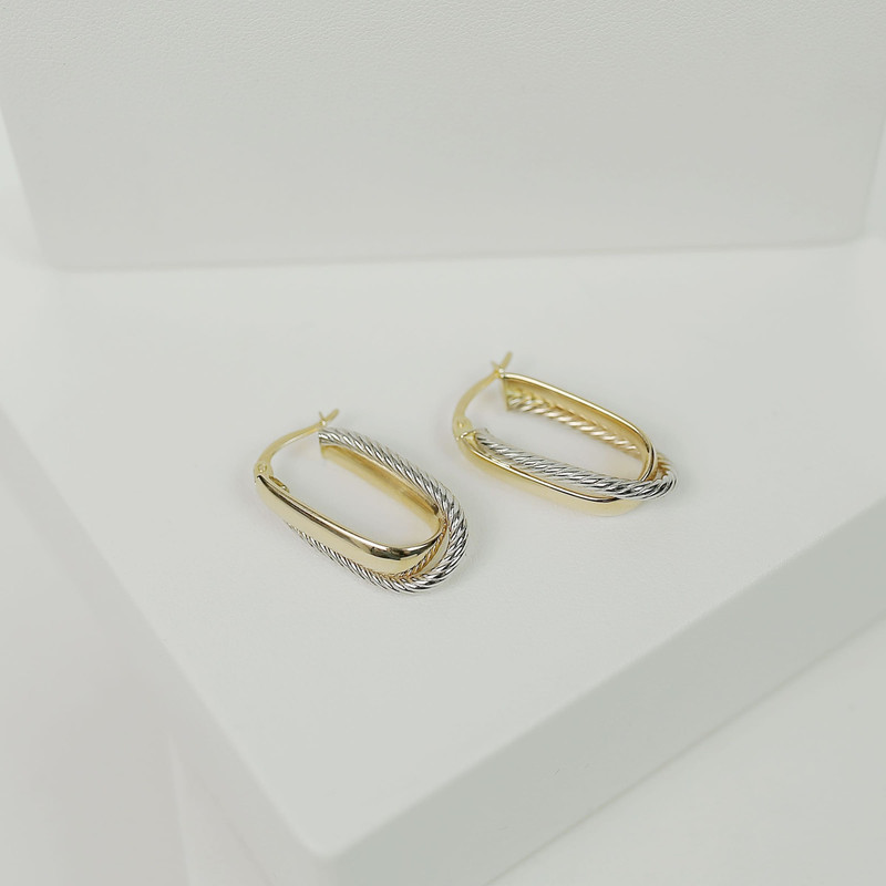 Second angle of the same two-tone twisted hoops on white blocks.